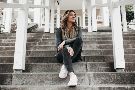 women sitting on steps